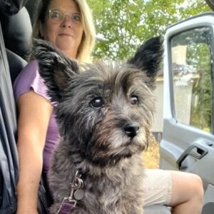 lady and dog in a car