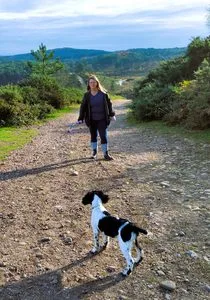 Autumn hiking with dogs on a countryside trail